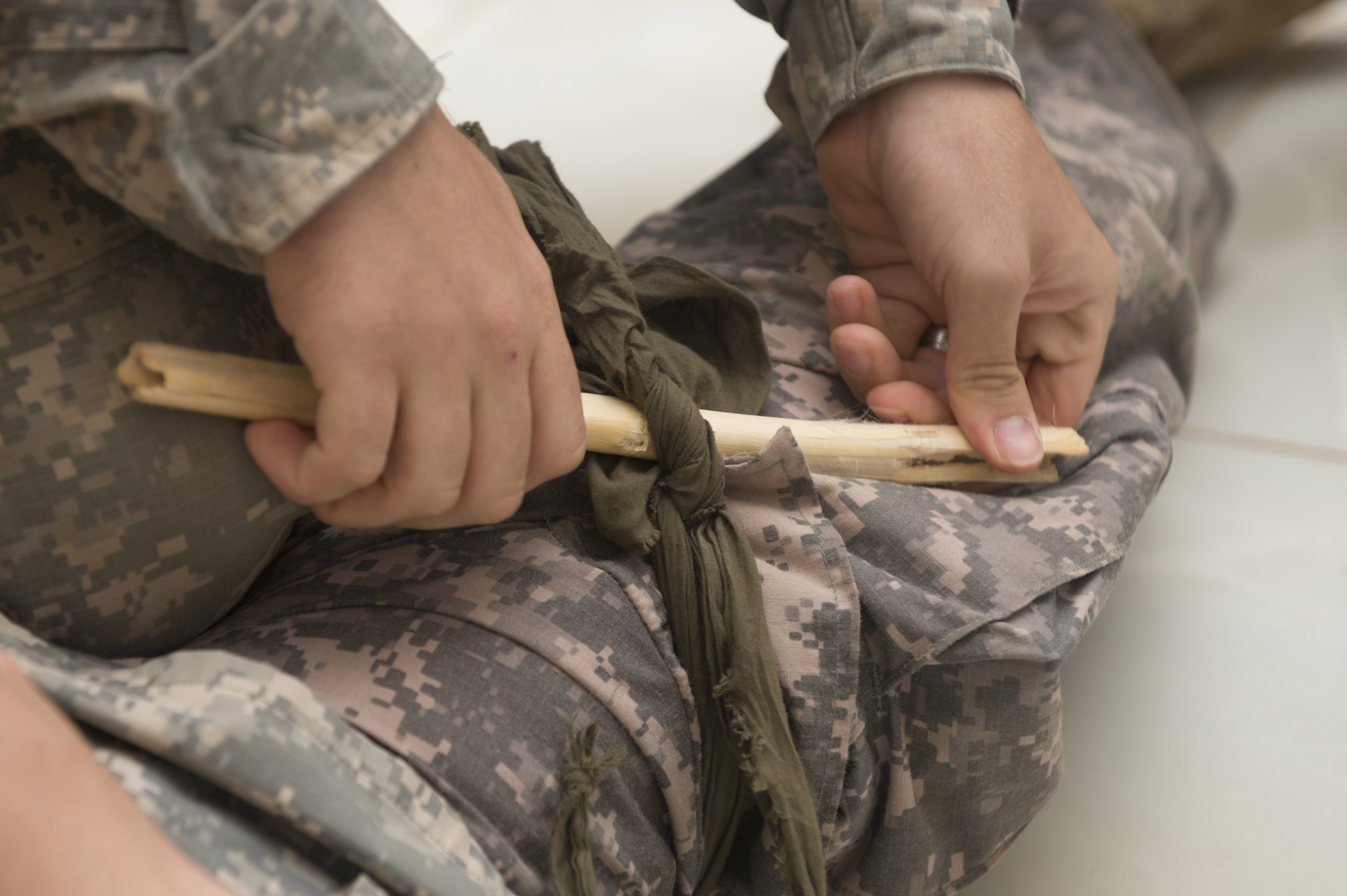 Two U.S. Army sergeants display the way they are trained to apply a